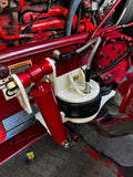 Heavy duty truck suspension system with red and white custom components and air ride parts