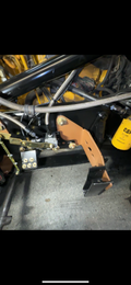 Heavy duty truck engine bay with braided steel hoses, custom metal bracket, and CAT filter