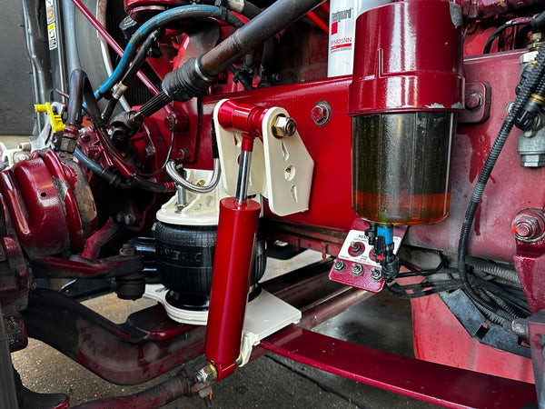 Heavy duty truck suspension and filter system with custom red and white parts installed