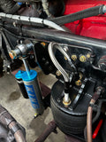 Heavy duty truck suspension with King shock absorber, Goodyear air spring, and braided lines