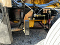Heavy duty truck suspension system with shock absorber and hydraulic lines closeup