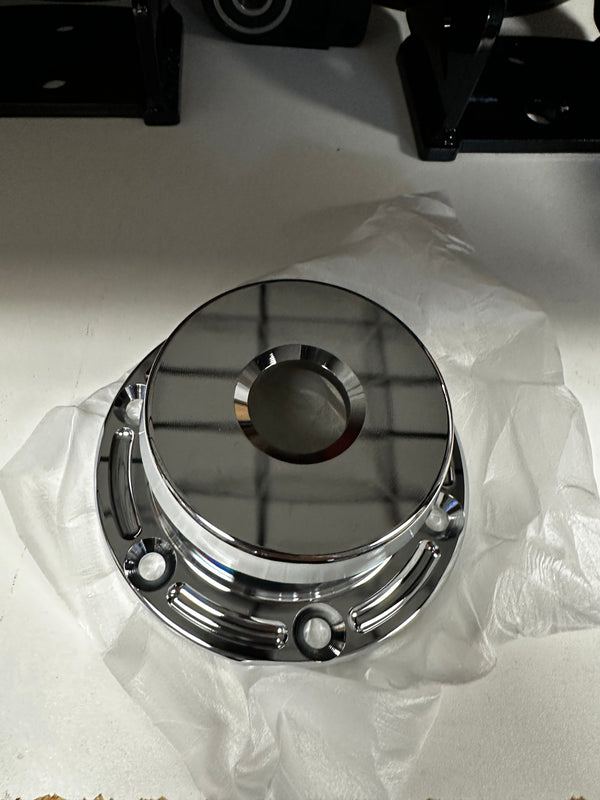 Polished metal truck hub cover for heavy duty drivetrain repair on white background