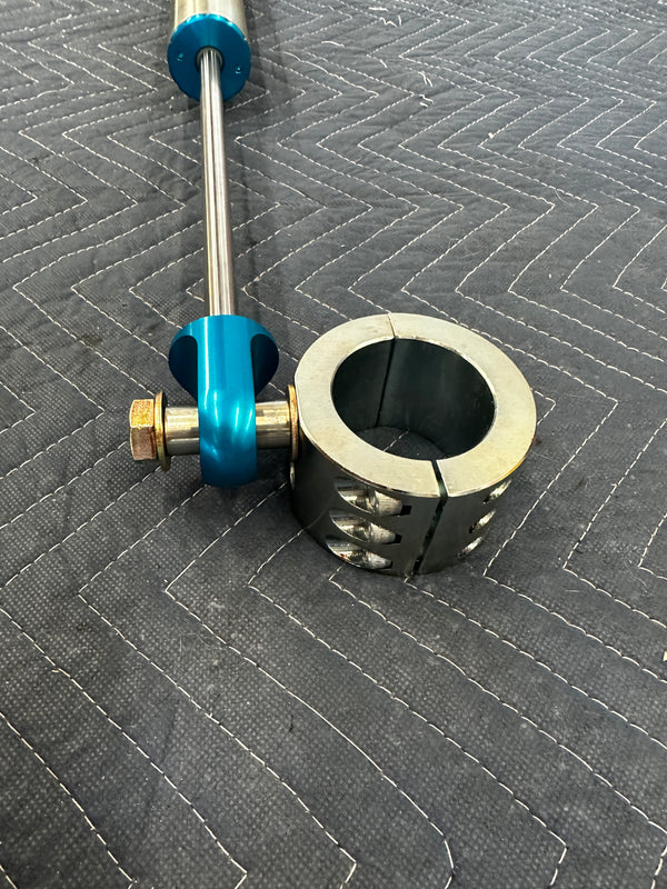 Heavy duty truck drivetrain component with metal shaft and blue anodized parts on quilted surface